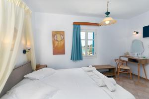 Postel nebo postele na pokoji v ubytování Akteon Hotel