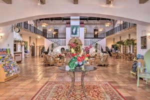 a lobby with a table with flowers on it at Everglades Condo 15 Mi to Natl Park Boat and Swim! in Naples