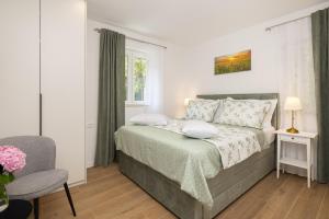 a bedroom with a bed and a window at La Perla - Downtown House in Omiš