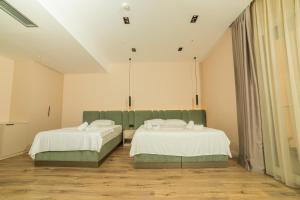 Hotel Umma客房内的一张或多张床位