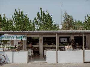 a restaurant with a dog sitting inside of it at Holiday Home Il Pioppeto by Interhome in Vasto