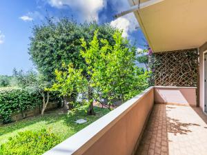 a view from the balcony of a house with a tree at Apartment Piccolo Leccio by Interhome in Cecina