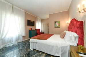 Postel nebo postele na pokoji v ubytování Prestige Suite Via Romagnoli
