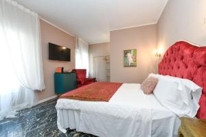 Postel nebo postele na pokoji v ubytování Prestige Suite Via Romagnoli