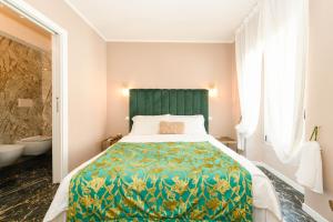 Postel nebo postele na pokoji v ubytování Prestige Suite Via Romagnoli