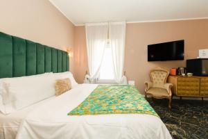 Postel nebo postele na pokoji v ubytování Prestige Suite Via Romagnoli