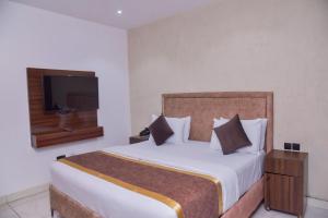 Krevet ili kreveti u jedinici u okviru objekta Formula 2 Hotels and Suites