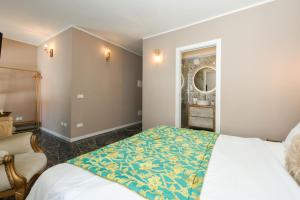 Postel nebo postele na pokoji v ubytování Prestige Suite Via Romagnoli