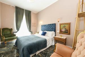 Postel nebo postele na pokoji v ubytování Prestige Suite Via Romagnoli