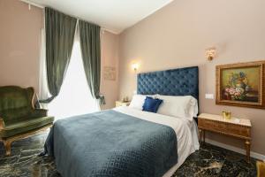 Postel nebo postele na pokoji v ubytování Prestige Suite Via Romagnoli