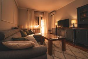 a living room with a couch and a table at Vintage in Đakovo