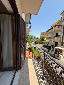 a balcony of a building with a view of a street at Kapo Azzurro in Monterotondo