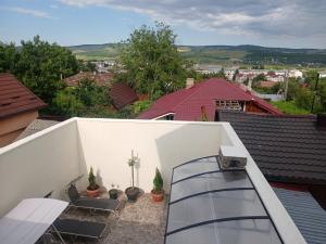 a balcony with a glass staircase on a house at Cazare Paiu VasiVasi in Vaslui