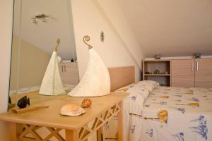 Posteľ alebo postele v izbe v ubytovaní Adriana casa vacanze mare Etna Sicilia