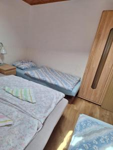 Postel nebo postele na pokoji v ubytování Chata Mária