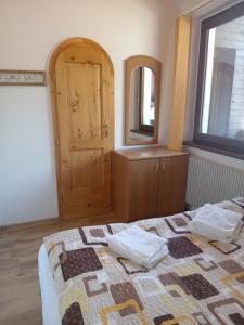 Posteľ alebo postele v izbe v ubytovaní Apartmány Šmika