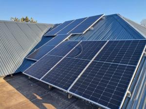 a group of solar panels on top of a roof at The Mandy Guesthouse in Kokstad