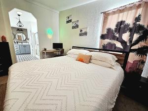 a bedroom with a large white bed in a room at Indian Cove in Twentynine Palms