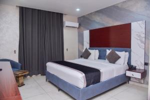 Krevet ili kreveti u jedinici u okviru objekta Formula 2 Hotels and Suites