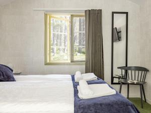 Ένα ή περισσότερα κρεβάτια σε δωμάτιο στο Holiday Home Hölick Minichalet Plus 6 by Interhome