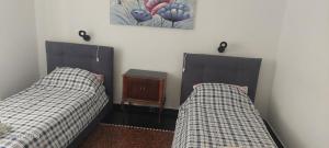 two beds sitting next to each other in a room at Casa delle fiabe in Sestri Levante
