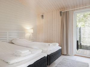 Ένα ή περισσότερα κρεβάτια σε δωμάτιο στο Holiday Home Lagunen Villa 3 by Interhome
