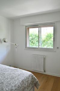 Ένα ή περισσότερα κρεβάτια σε δωμάτιο στο Camille Homestay - Rennes centre - 10min gare et centre historique