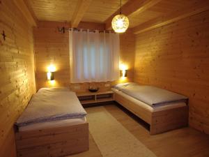 Voodi või voodid majutusasutuse Ferienhaus Weerberg toas