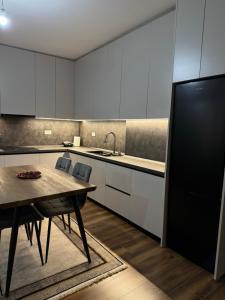 Kuchyň nebo kuchyňský kout v ubytování GLAD Apartment