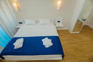 A bed or beds in a room at DOWNTOWN Centre in Batumi Aparthotel Orbi City N1