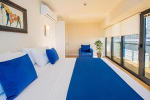 A bed or beds in a room at DOWNTOWN Centre in Batumi Aparthotel Orbi City N1