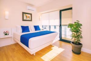 A bed or beds in a room at DOWNTOWN Centre in Batumi Aparthotel Orbi City N1