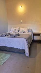 a bedroom with a large bed in a room at La Valentina in Purmamarca
