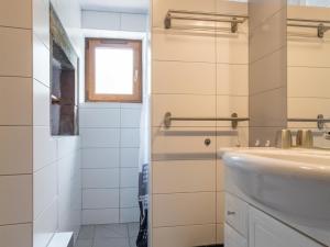 a bathroom with a sink and a window at Gîte paisible dans ancienne ferme comtoise avec animaux acceptés - FR-1-583-416 in Saint-Bresson +27 photos