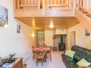 a living room with a couch and a table at Gîte de charme dans les Vosges Saônoises - FR-1-583-412 in Saint-Bresson +24 photos