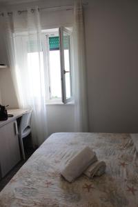 Postel nebo postele na pokoji v ubytování Borgo Marinaro Cetraro, Calabria