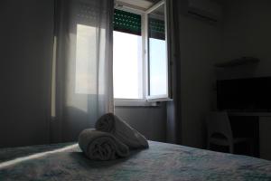 Postel nebo postele na pokoji v ubytování Borgo Marinaro Cetraro, Calabria