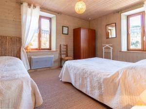 Postel nebo postele na pokoji v ubytování Gîte éco au pied des montagnes, proche du Ballon de Servance - FR-1-583-449