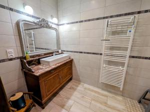 a bathroom with a sink and a mirror at Maison de caractère à Gy avec parking et Wifi - FR-1-583-448 in Gy +27 photos
