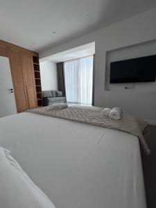 Postel nebo postele na pokoji v ubytování Escape Suites