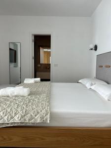 Postel nebo postele na pokoji v ubytování Escape Suites