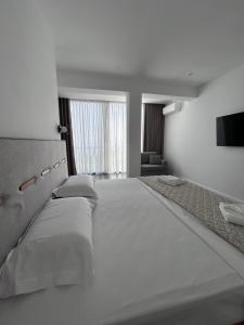Postel nebo postele na pokoji v ubytování Escape Suites