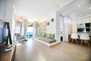 a living room with a couch and a table at Blue Horizon Apartment in Kalymnos