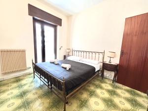 a bedroom with a bed with two towels on it at Quadrilocale vista mare completamente climatizzato in Gallipoli +14 photos