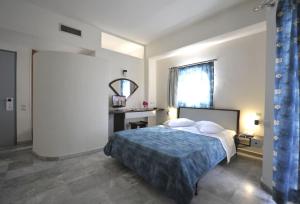 Posteľ alebo postele v izbe v ubytovaní Rodon Hotel