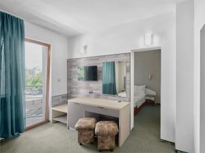 TV a/nebo společenská místnost v ubytování Hotel Opal