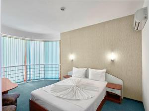 Postel nebo postele na pokoji v ubytování Hotel Opal