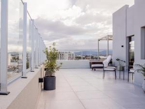 an apartment balcony with a view of the city at Joy Tower by FMA Coliving in Salta