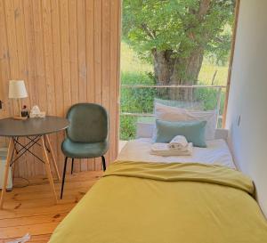Ένα ή περισσότερα κρεβάτια σε δωμάτιο στο Nature Rooms cabin