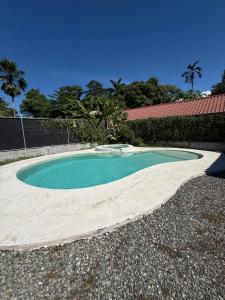 a small pool of water in a yard at Pool House with free bikes! in Puerto Viejo